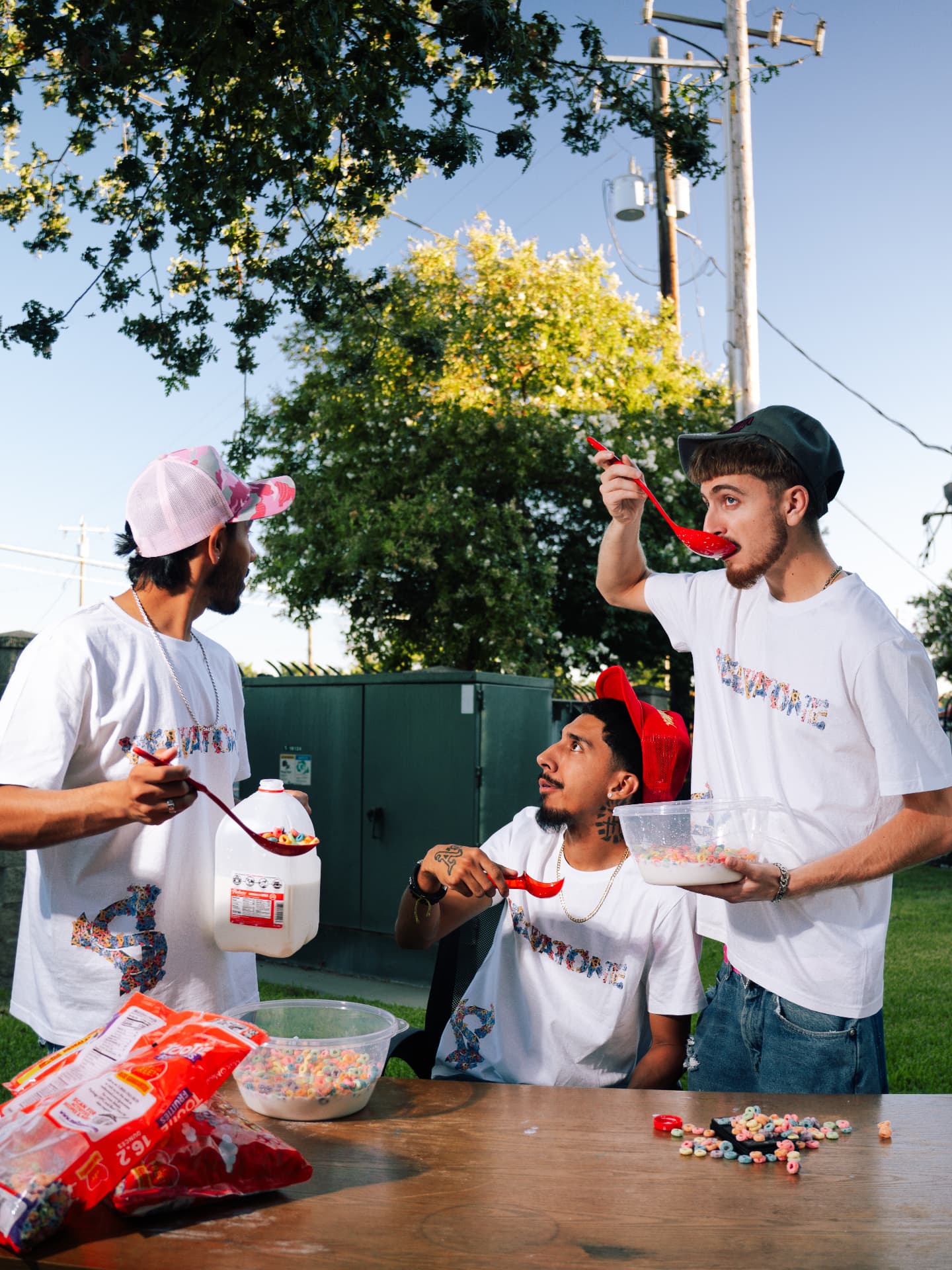 Three friends wearing the VELVATONE tee outdoors